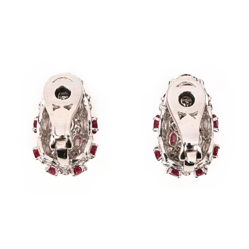 A pair of ruby and diamond earclips | Woolley and Wallis