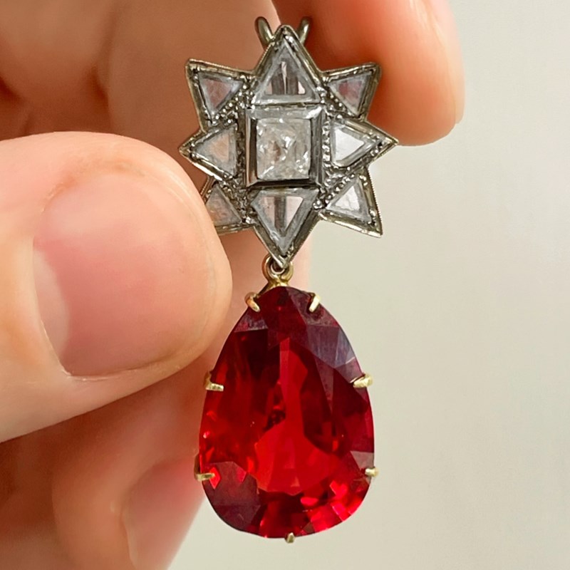 Spinel Reference Front View A fine red spinel and diamond pendant, the pear-shaped spinel weighing ...