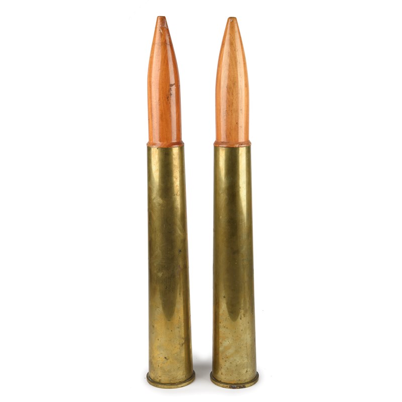 Fixed Shell Case Two 76/62mm naval artillery shell cases, each fixed with a turned wood ...