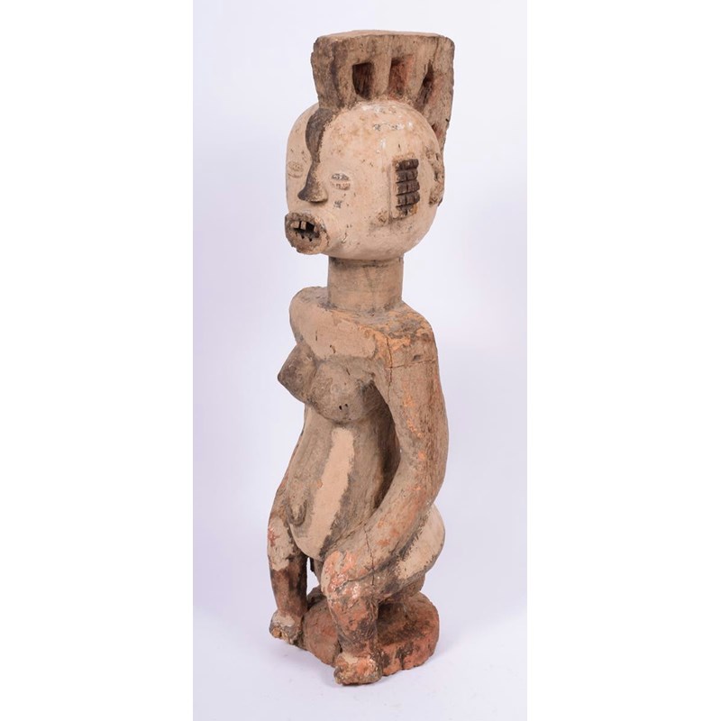 A west african seated female figure | Woolley and Wallis