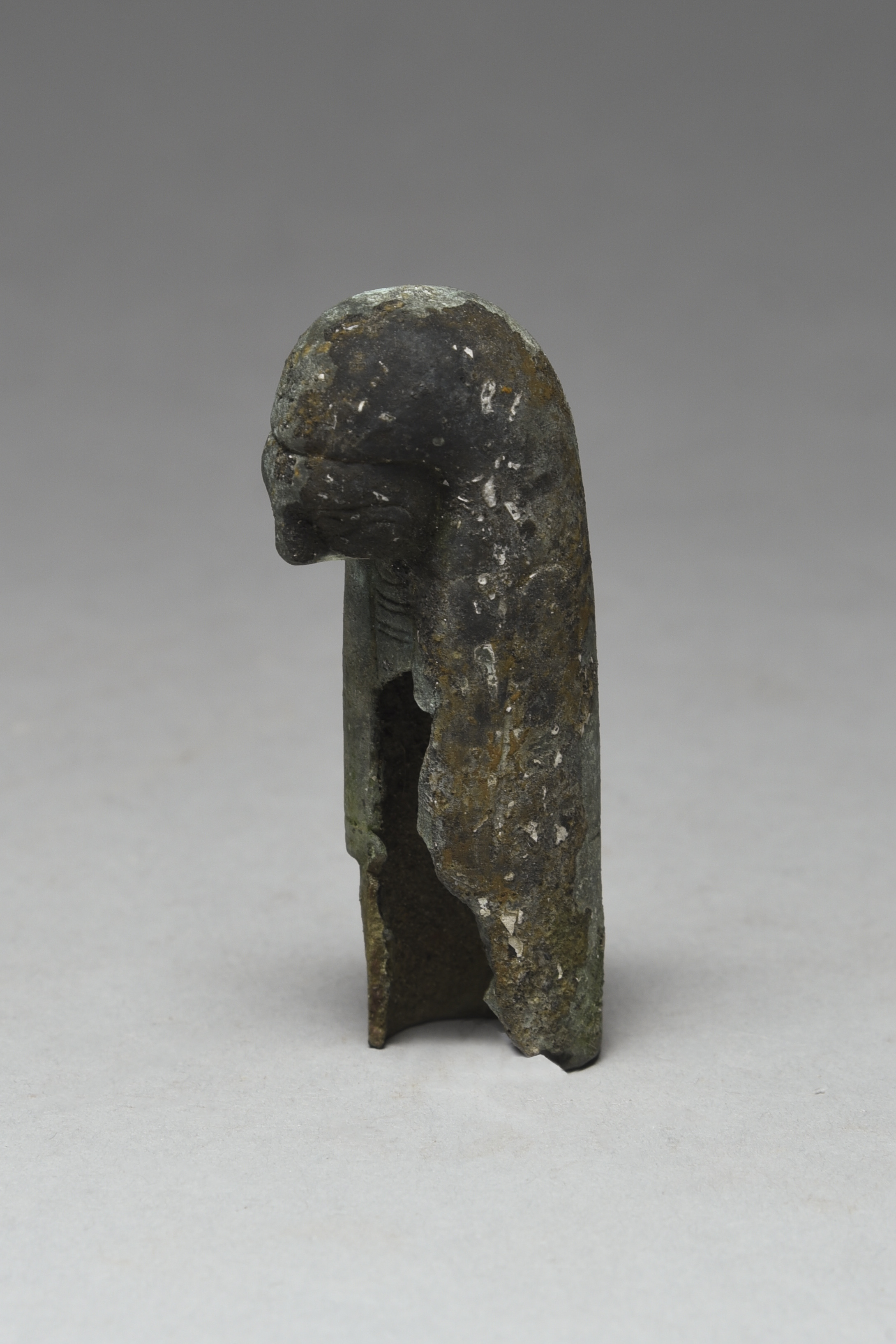 An Egyptian bronze falcon-headed cista handle