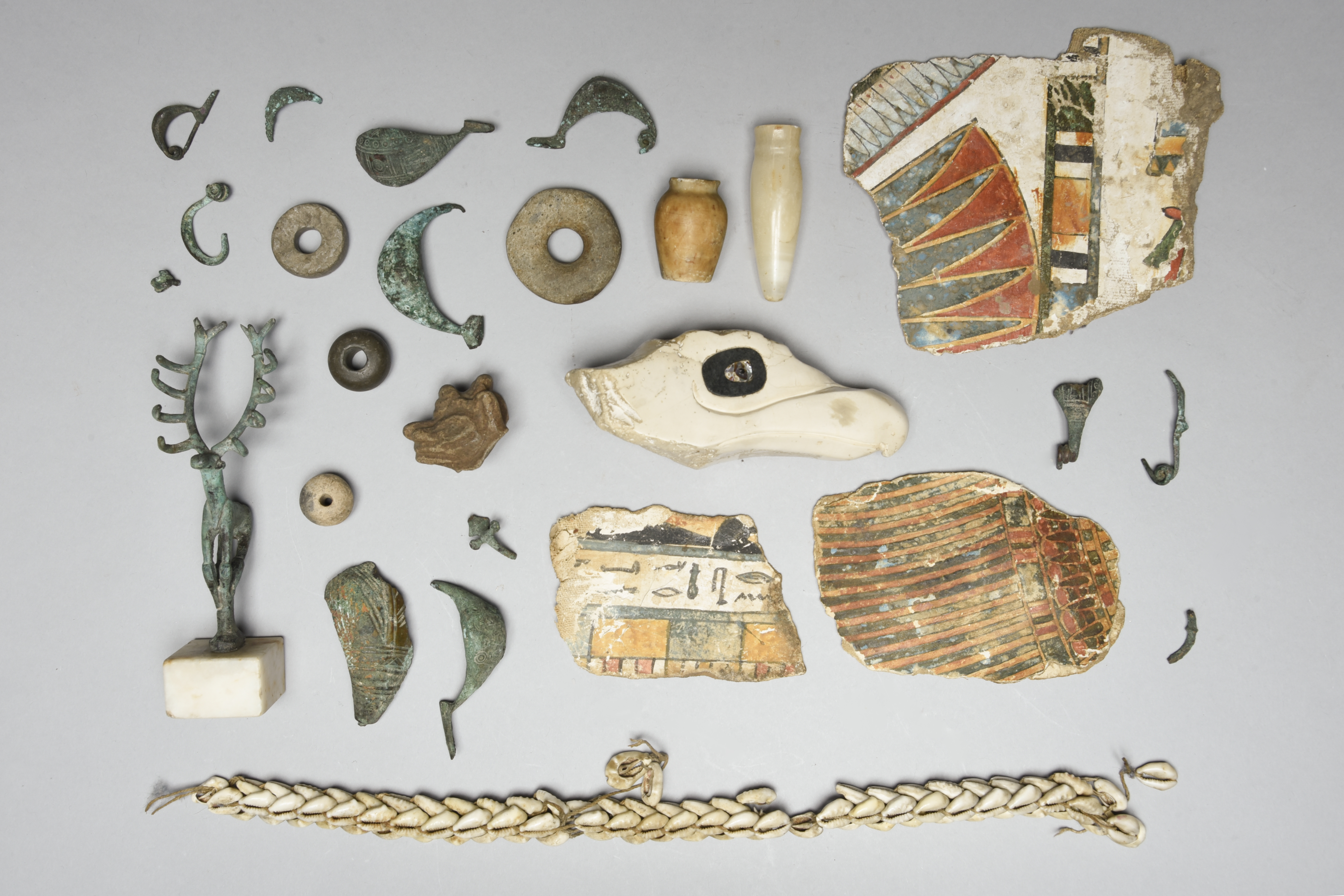 Three Egyptian painted cartonnage fragments