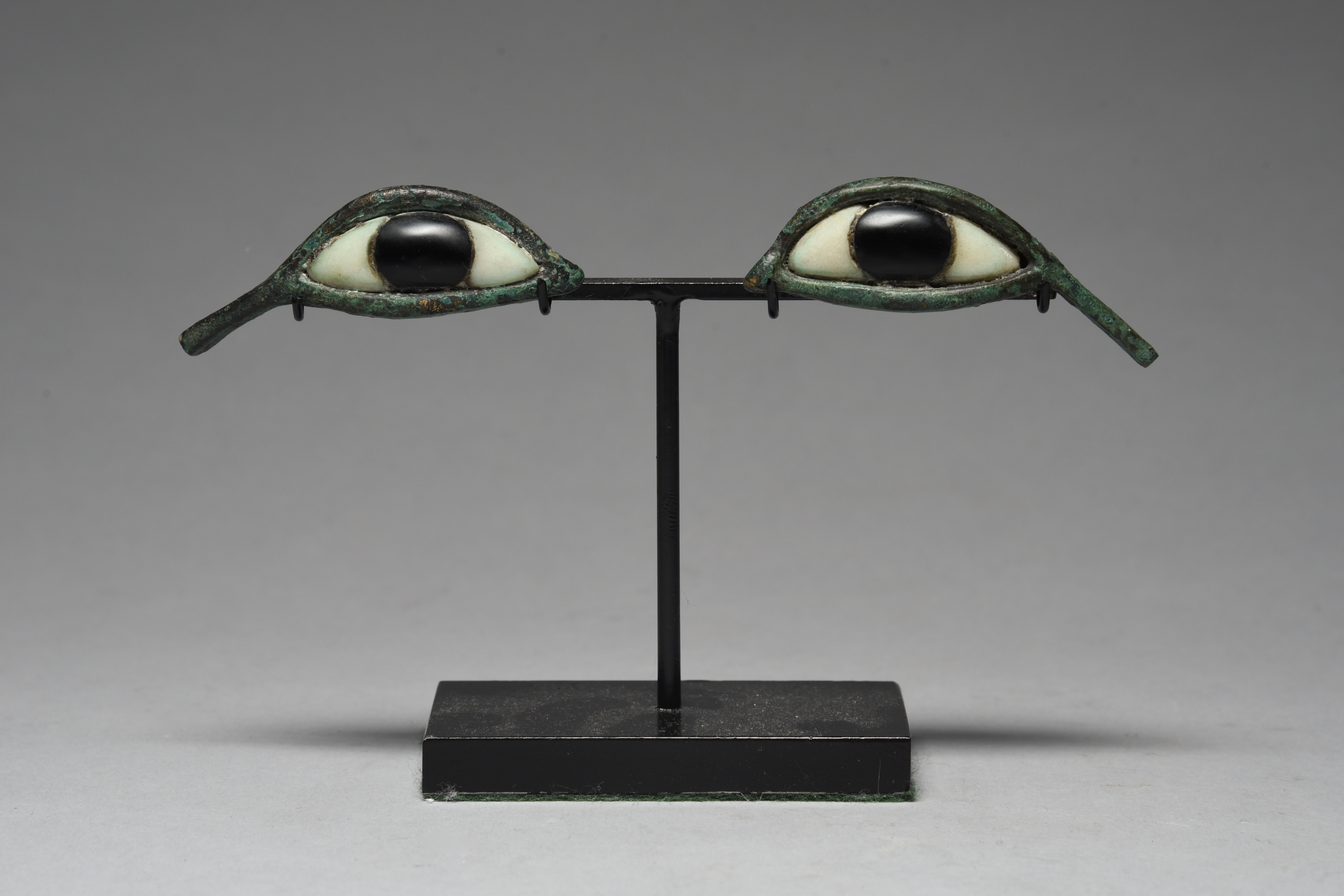 A pair of Egyptian style bronze eyes
