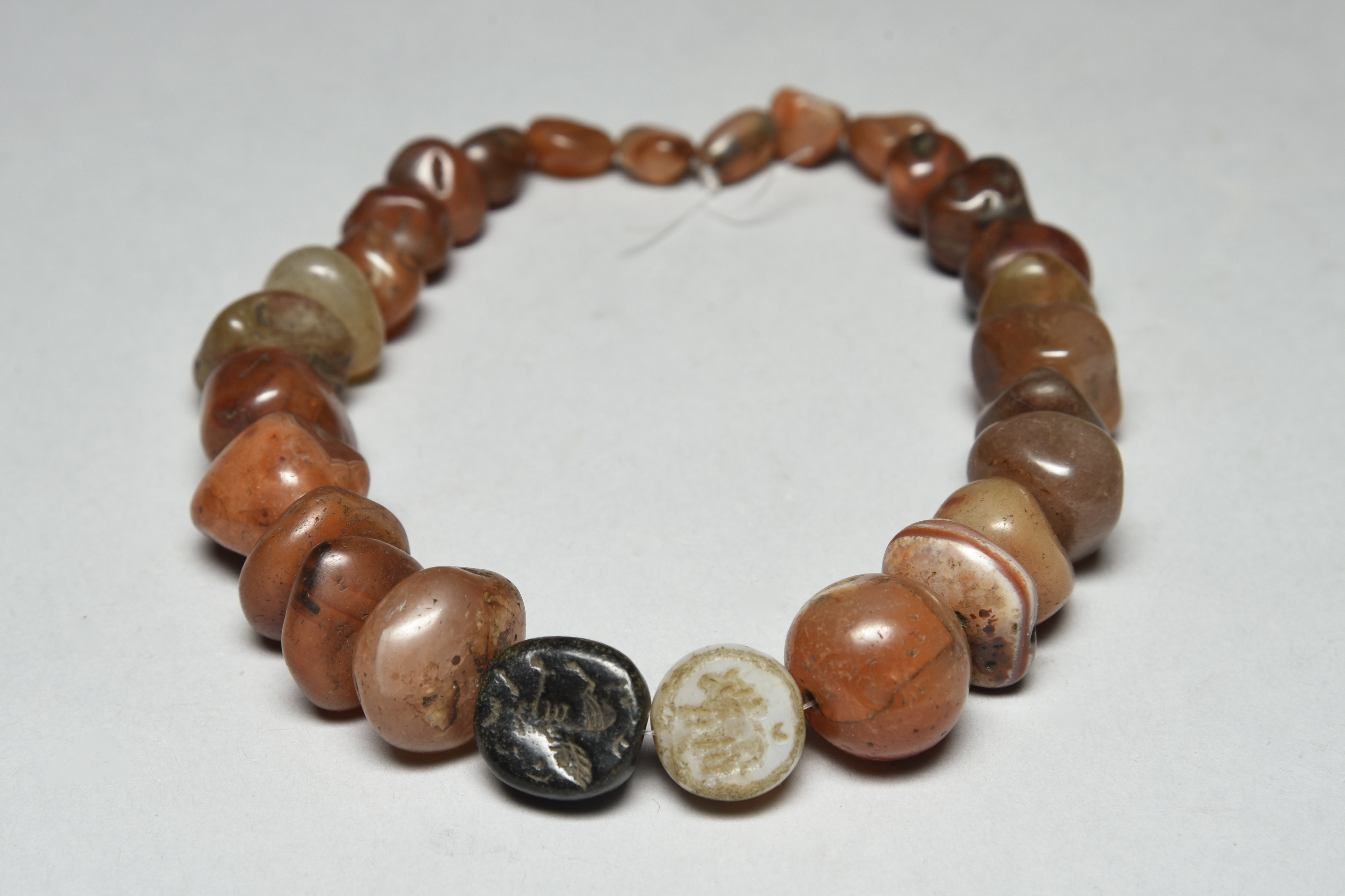 A graduated set of Middle Eastern chalcedony beads
